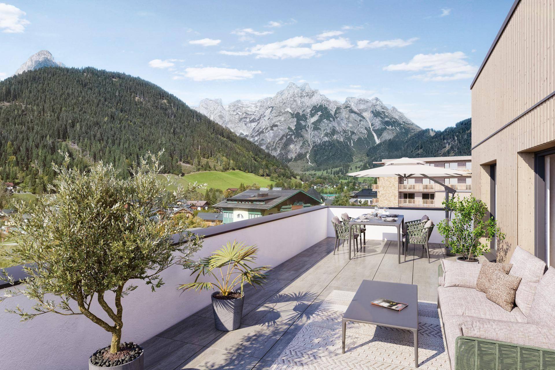 Geräumige Terrasse mit Sitzgelegenheiten und Pflanzen, die einen atemberaubenden Bergblick bietet.
