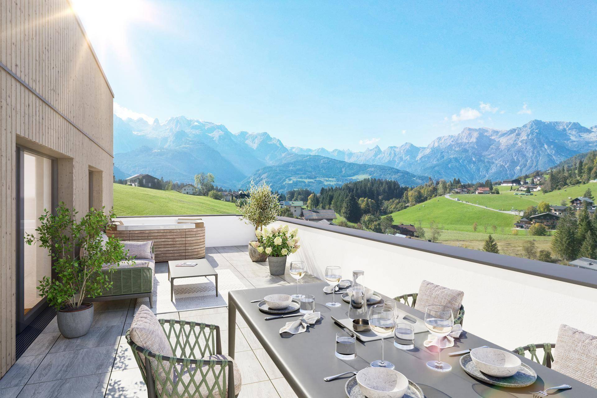 Sonnige Dachterrasse mit Essbereich, Lounge-Möbeln und weitem Panoramablick auf die Berge.