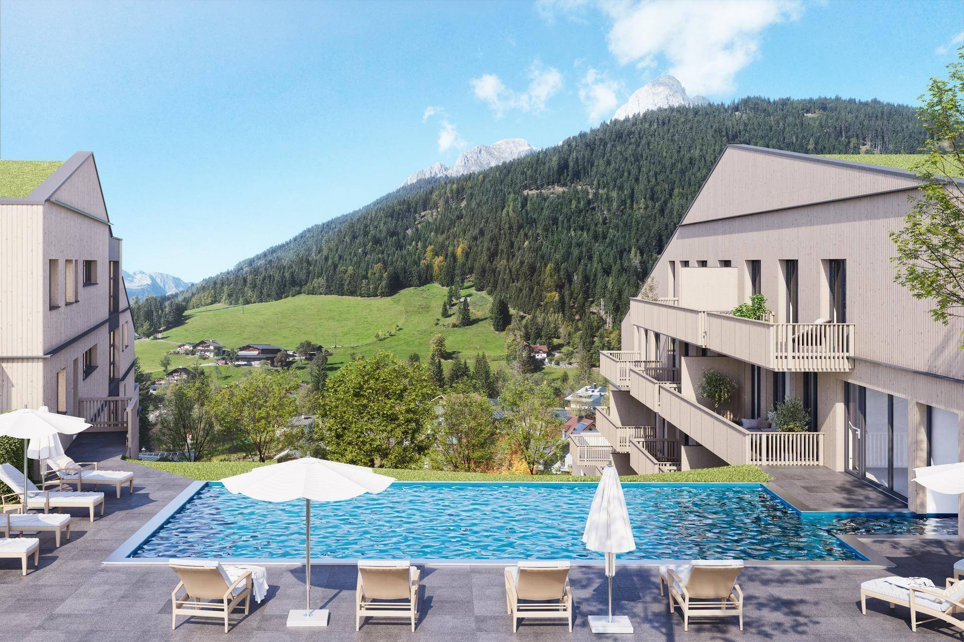 Außenpoolbereich mit Liegestühlen und Sonnenschirmen, umgeben von Bergen und grünen Hügeln.