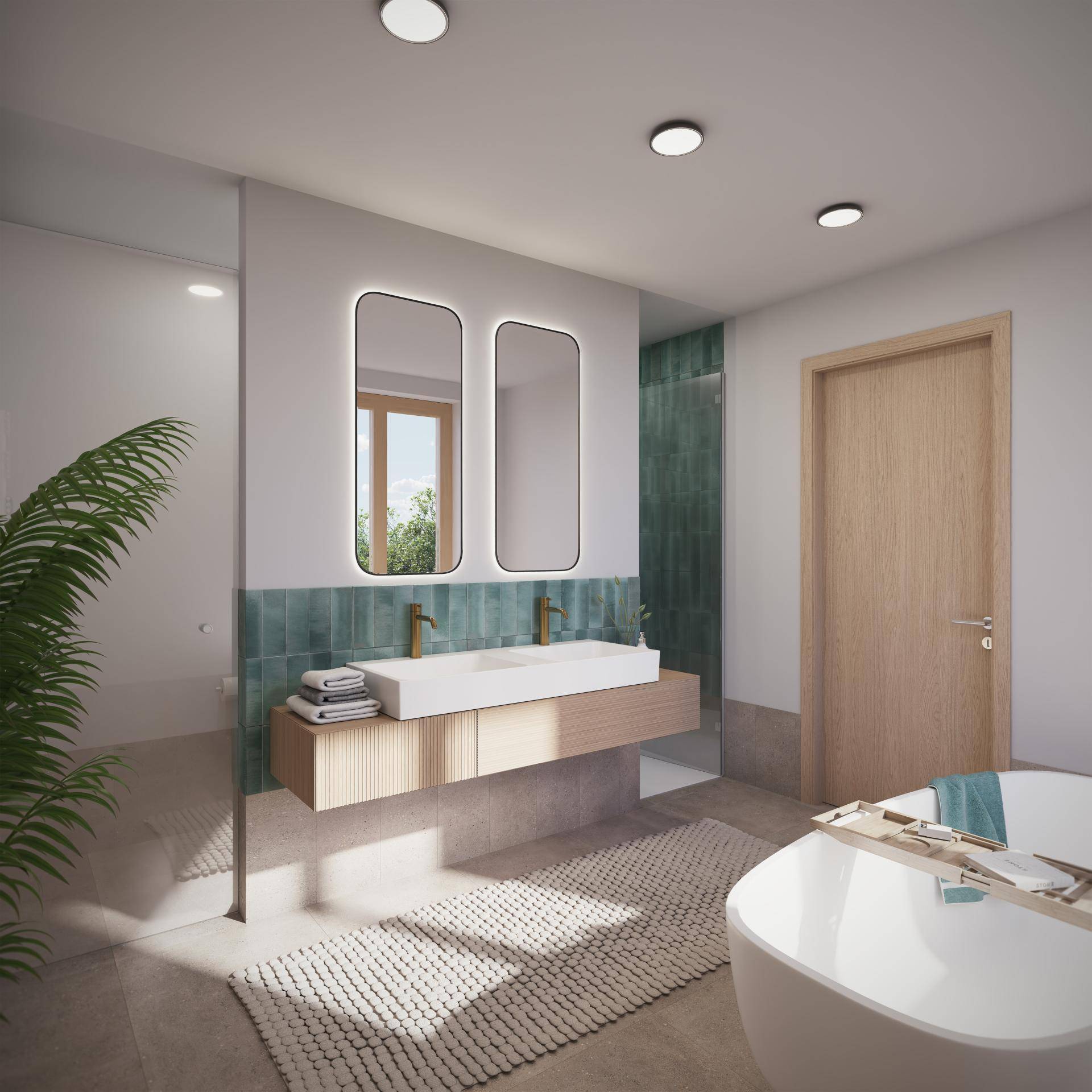 Modernes Badezimmer mit freistehender Badewanne, Doppelwaschbecken und grünen Fliesen, durchflutet von natürlichem Licht.