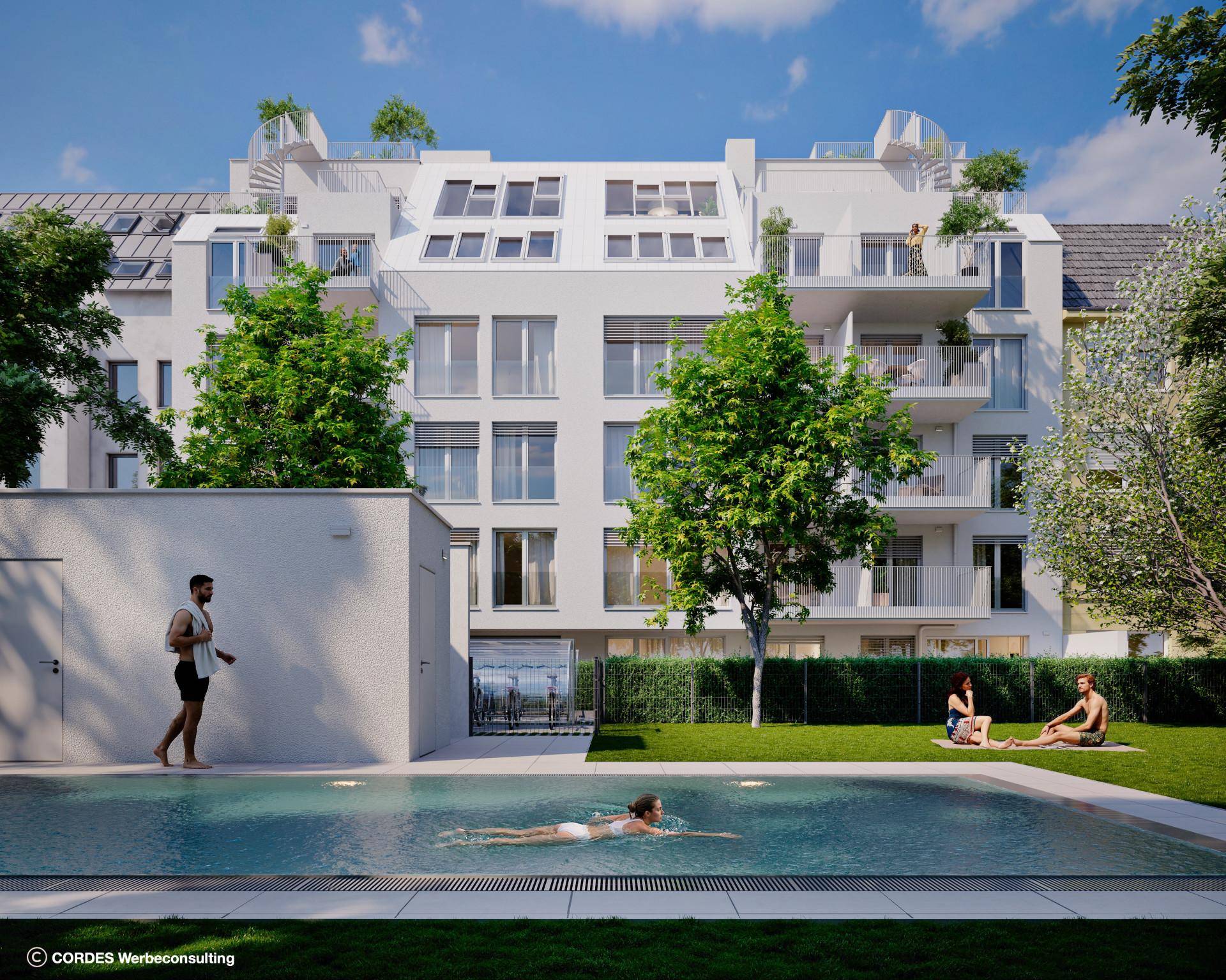 Entspannter Gemeinschaftsgarten mit großem Swimmingpool und Liegeflächen hinter der modernen Wohnanlage.