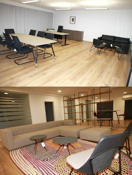 Großer Bürobereich mit Konferenztischen, Bürostühlen und einem separaten Lounge-Bereich mit Sofa für vielseitige Nutzung.