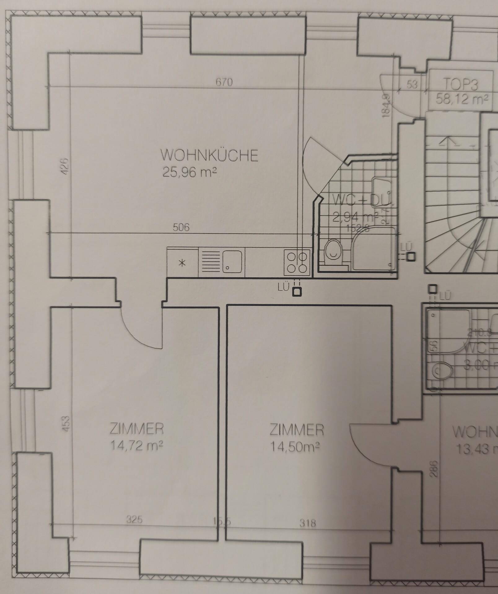 Grundriss einer Wohnung mit zwei Zimmern, Wohnküche und Bad, inklusive Maßen.