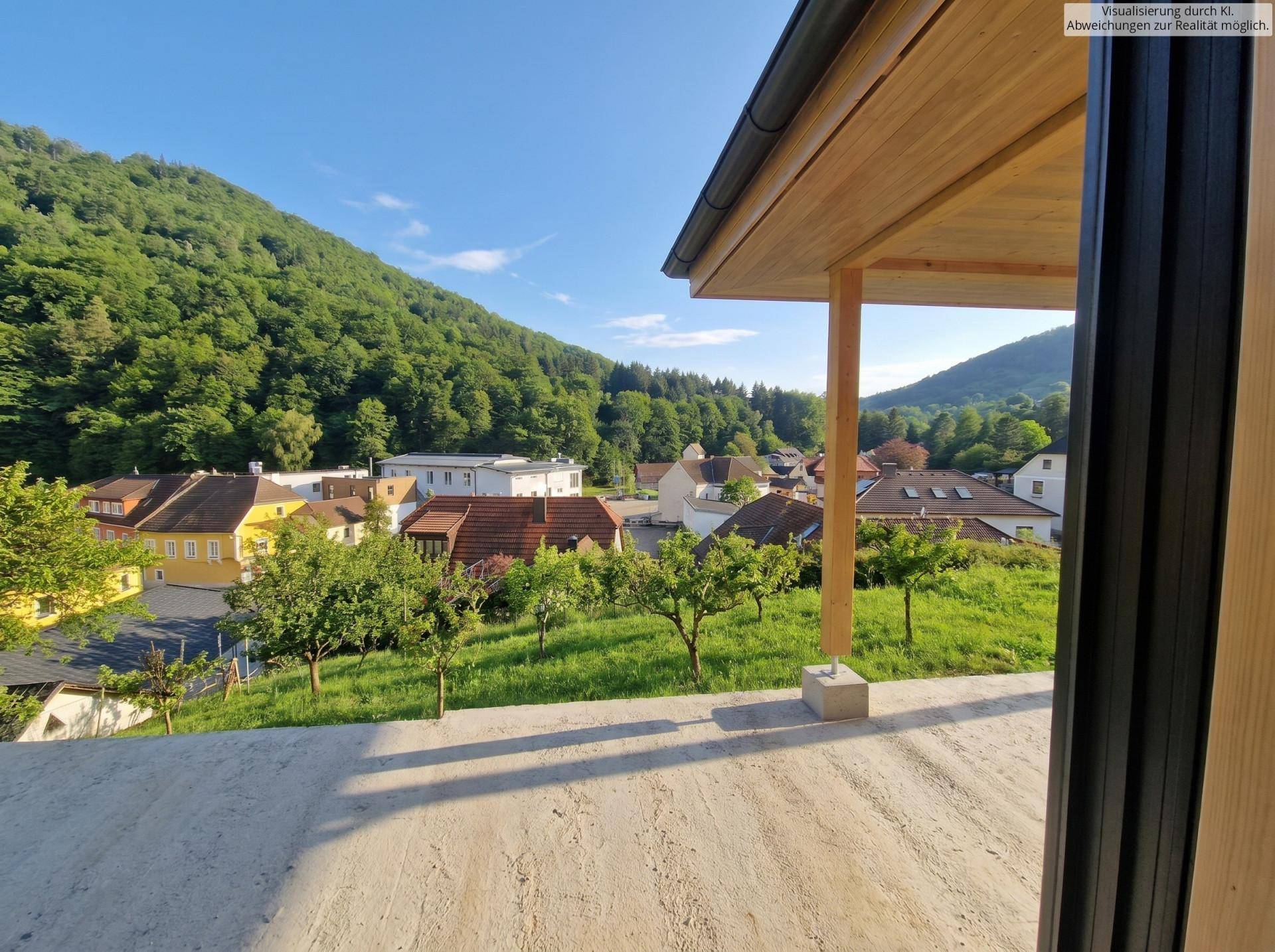 Überdachte Terrasse mit Holzbalken und weitem Blick auf die grüne Hügellandschaft und das Dorf.