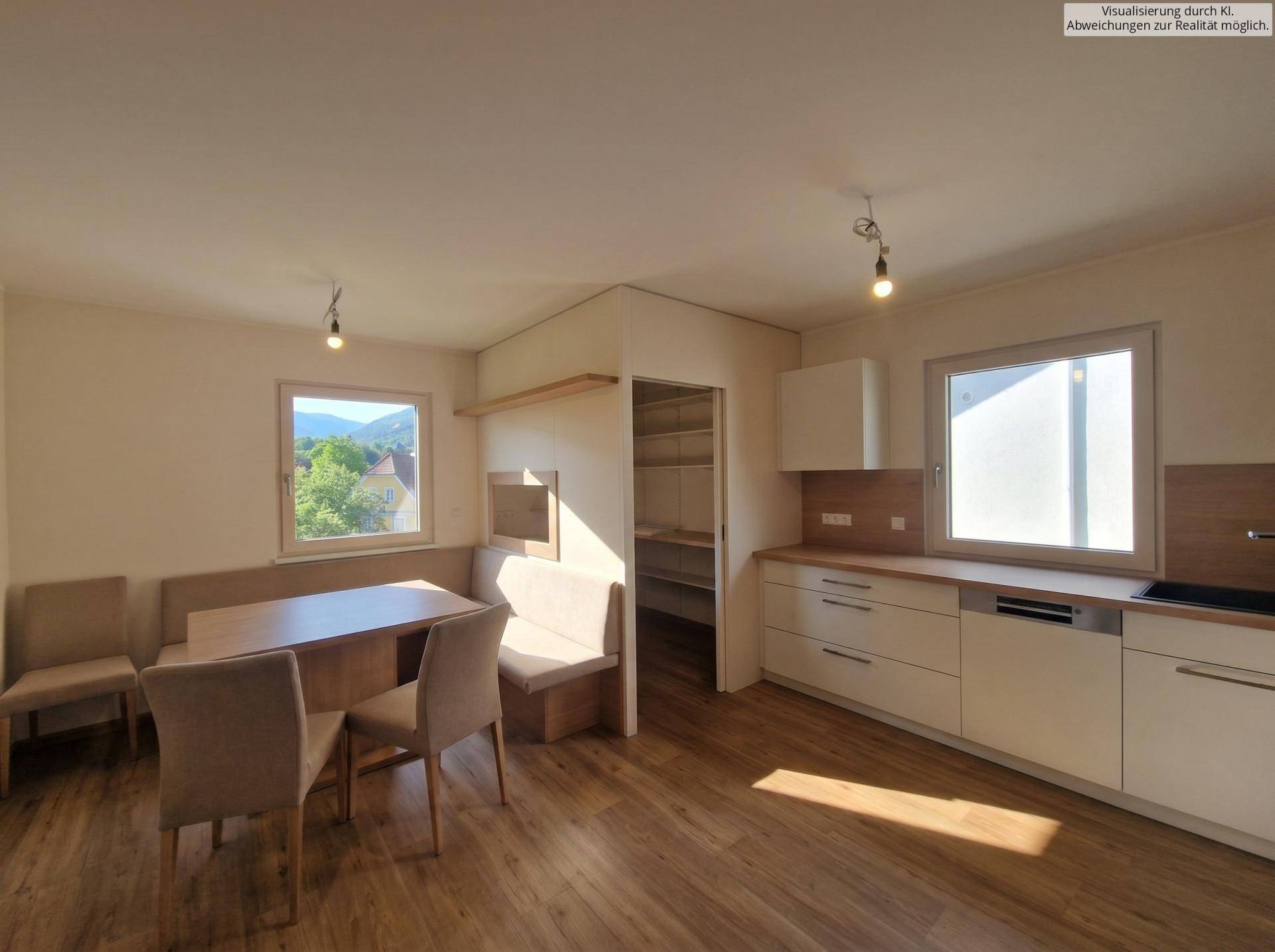 Helle Wohnküche mit Laminatboden, Einbauküche und gemütlicher Essecke am Fenster mit Ausblick.