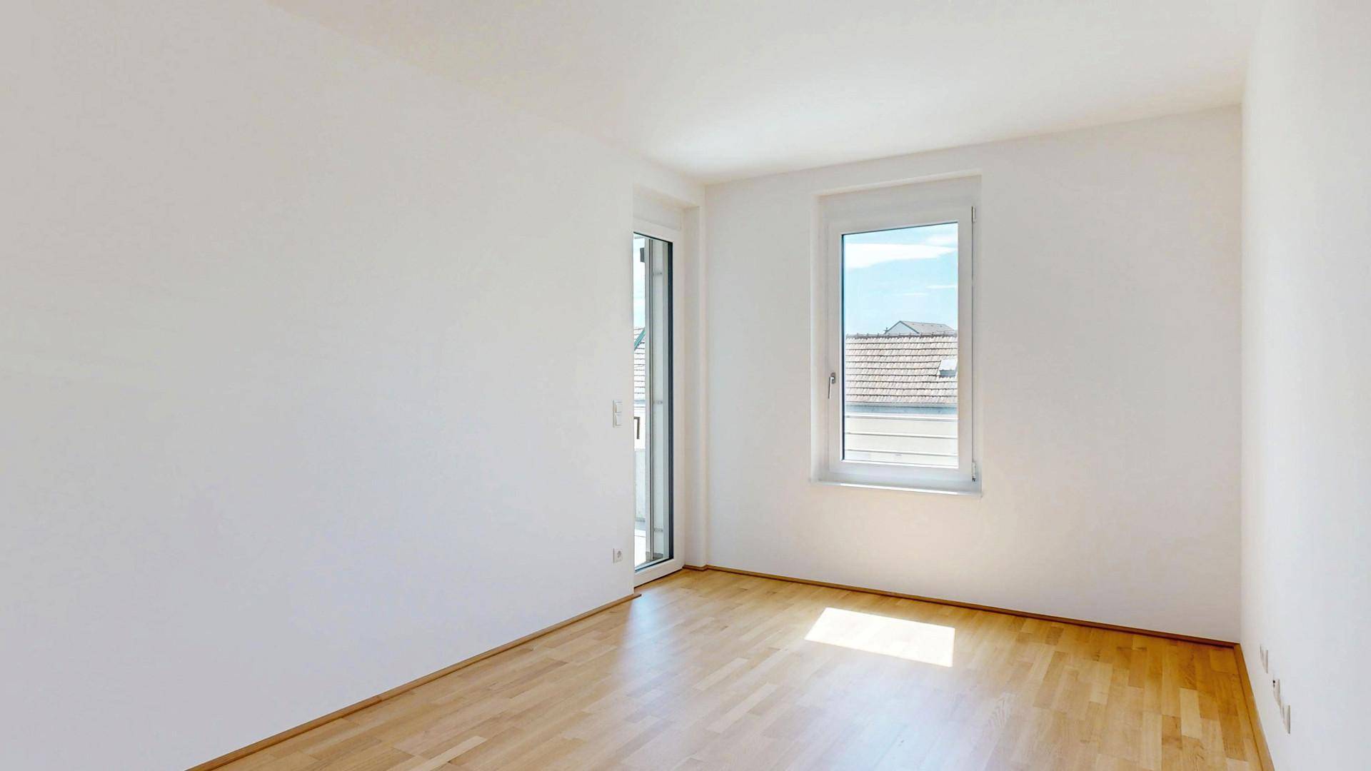 Schlafzimmer mit Ausgang auf Terrasse
