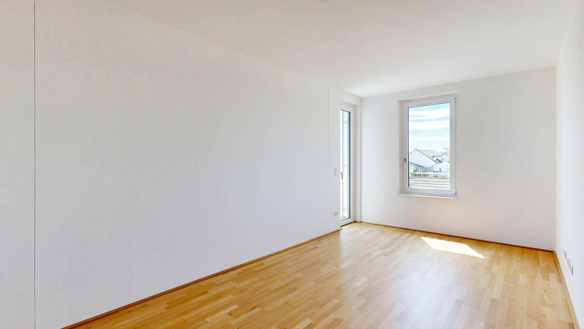 Schlafzimmer mit Ausgang auf Terrasse