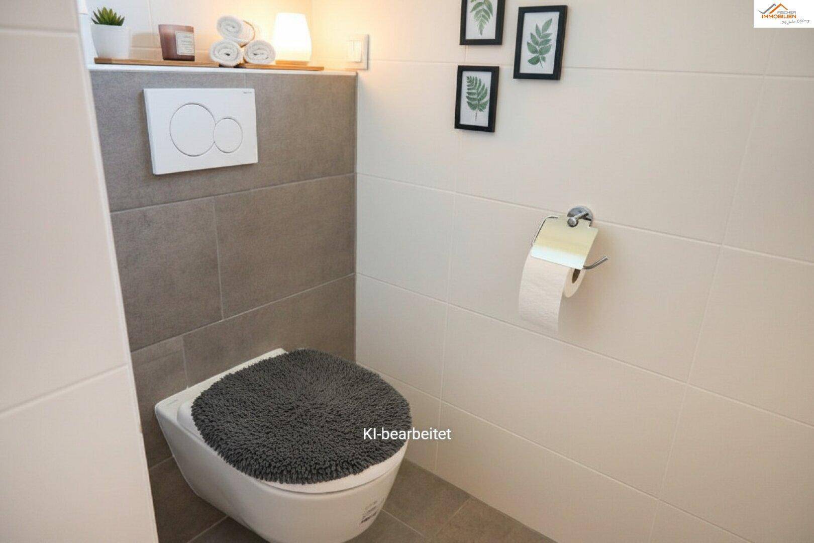 Modernes Gäste-WC mit Wand-WC und grauen sowie weißen Fliesen.