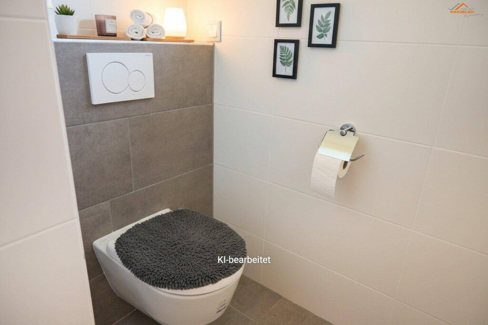 Modernes Gäste-WC mit wandhängender Toilette und stilvollen Fliesen, praktisch und pflegeleicht.