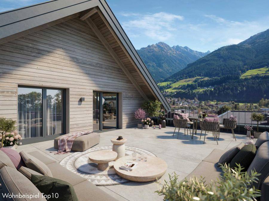 Großzügige Dachterrasse mit moderner Lounge-Möblierung und beeindruckendem Bergblick.