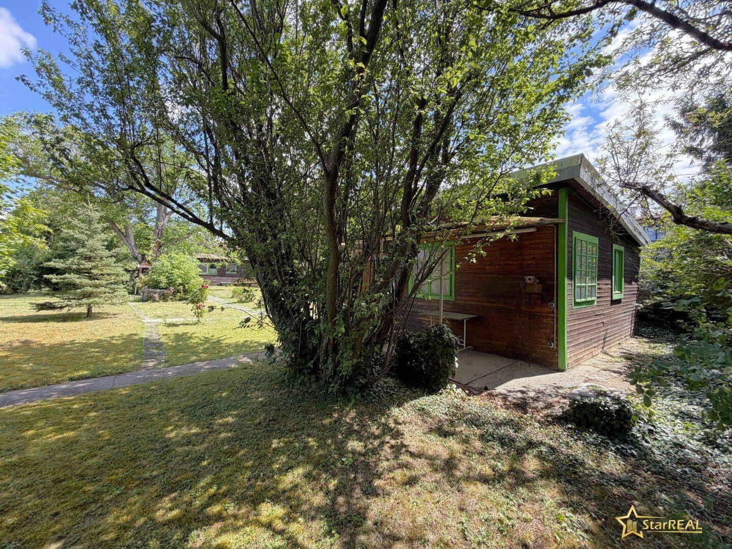 BAUEN ODER SOFORT GENIESSEN! 525 m² BAUGRUND MIT SOMMERHAUS &amp; WC/DUSCHE - Ansicht 2