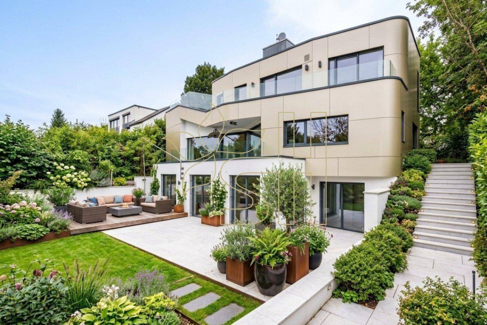 Elegante Terrasse mit Lounge-Möbeln, umgeben von einem üppigen, mehrstufigen Gartenbereich.