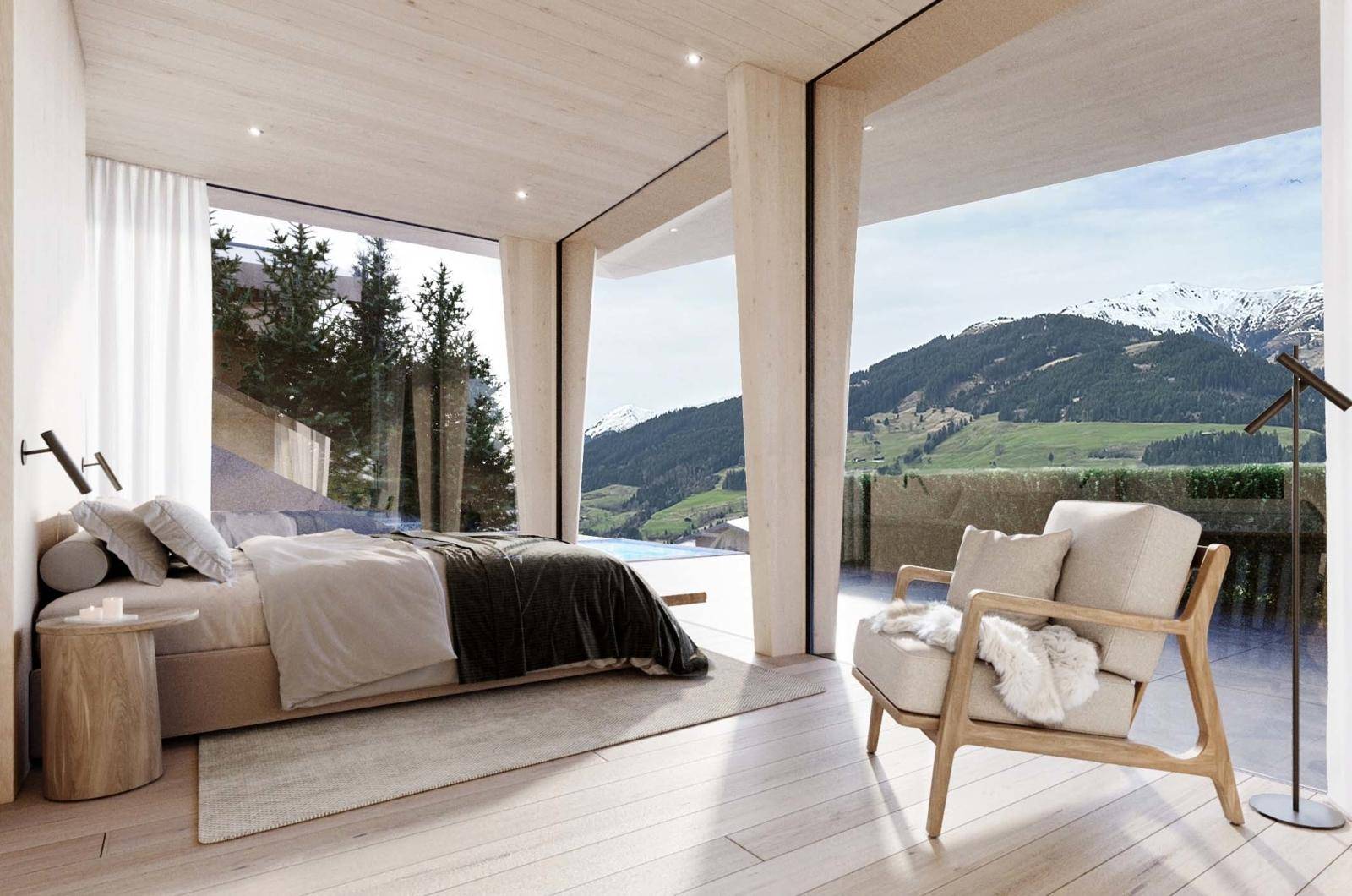 Modernes Schlafzimmer mit raumhohen Fenstern, Panoramablick auf die Berge und direktem Zugang zum Außenbereich mit Pool.