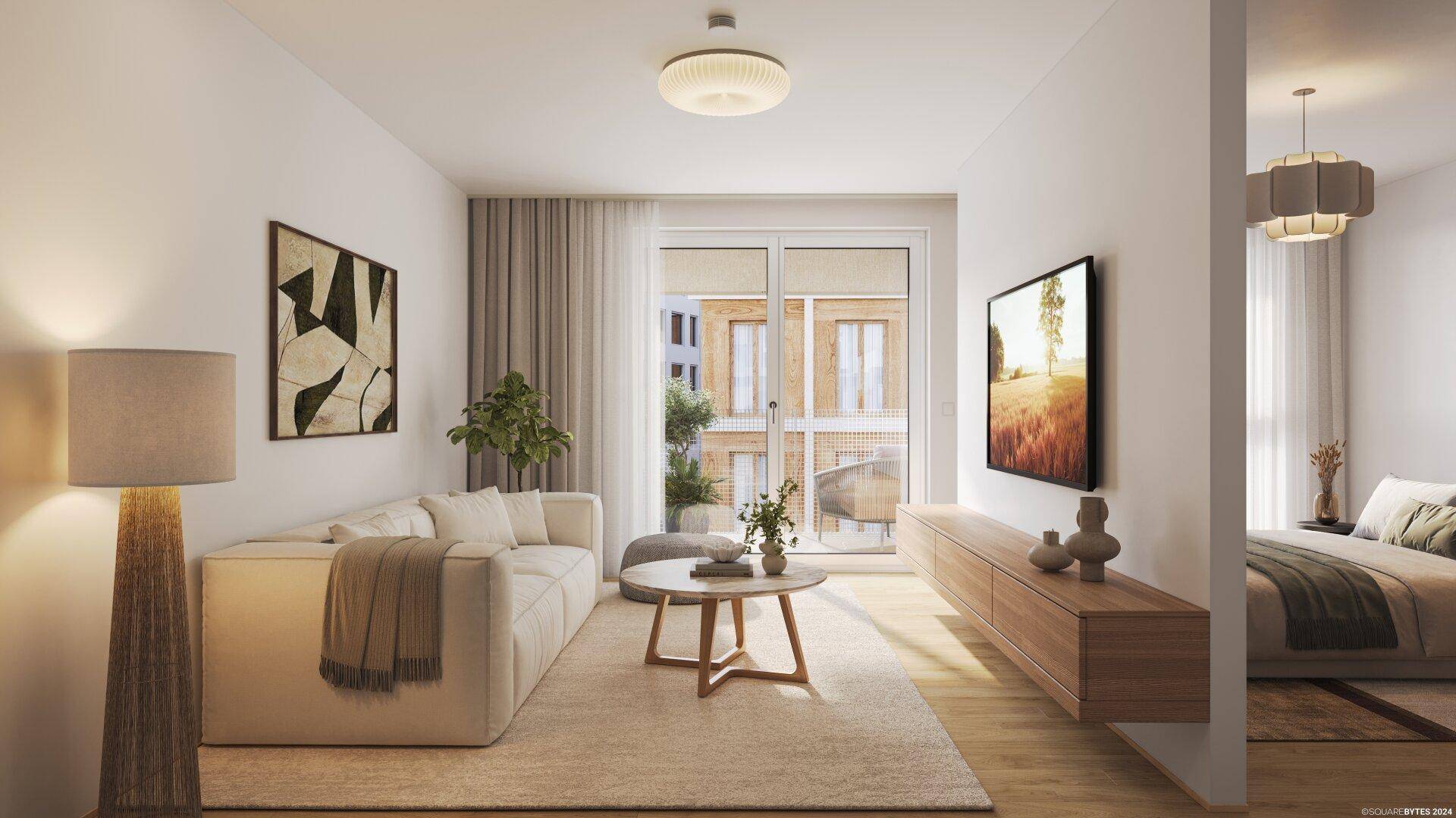 Helles Wohnzimmer mit beigem Sofa, Holzboden und Blick auf einen angrenzenden Schlafbereich.