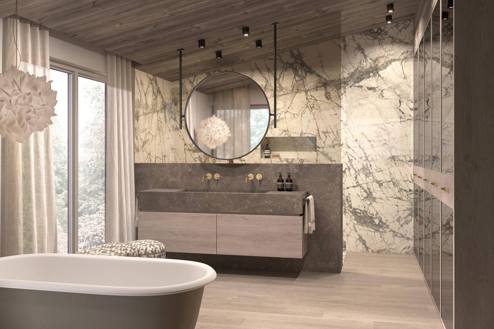 Luxuriöses Badezimmer mit freistehender Badewanne, Marmorwänden und großem runden Spiegel.