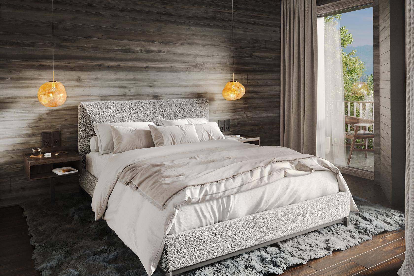 Gemütliches Schlafzimmer mit Holzwänden, großem Bett und Zugang zu einem Balkon mit grüner Aussicht.