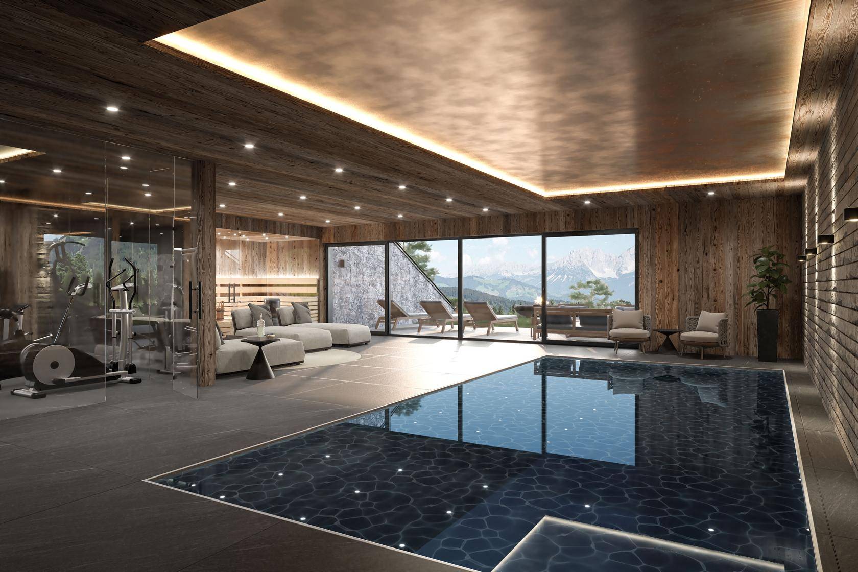 Exklusiver Wellnessbereich mit Innenpool, Fitnessgeräten und Panoramafenstern mit Bergblick.