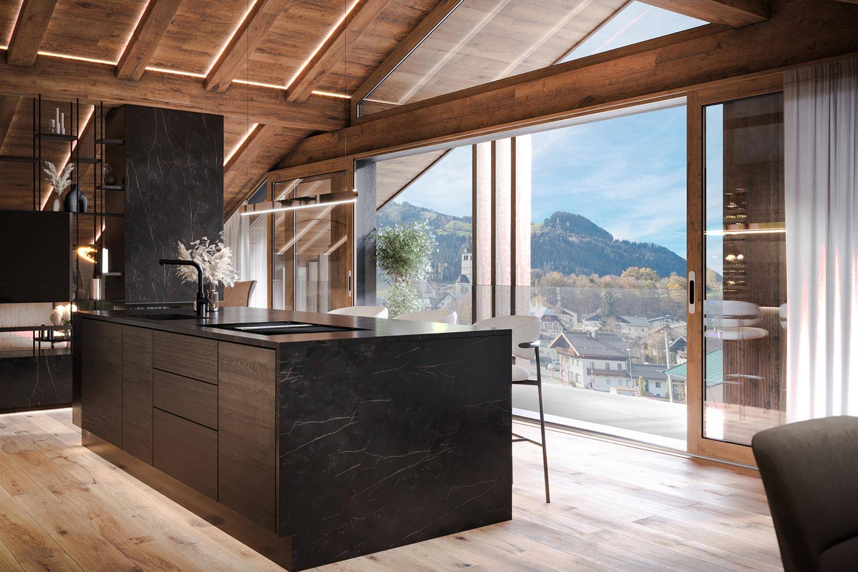 Moderne Küche mit großer Kochinsel und Panoramafenstern mit Blick auf das Dorf und die Berge.