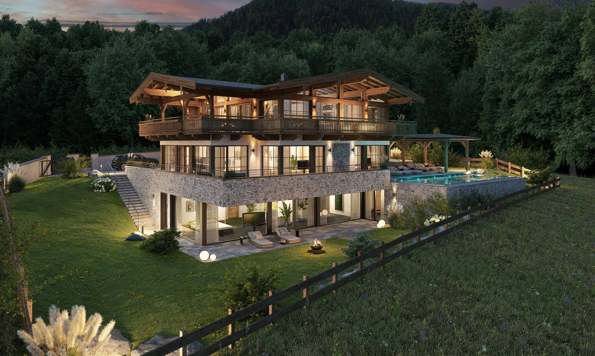 Beleuchtetes Chalet bei Sonnenuntergang mit Poolbereich und malerischem Bergblick.