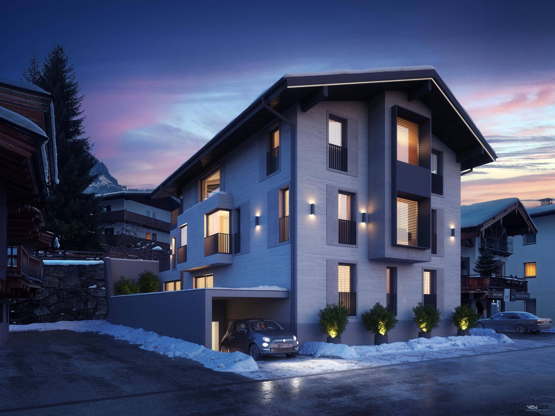 Modernes Gebäude in winterlicher Landschaft mit Carport und beleuchteten Fenstern.