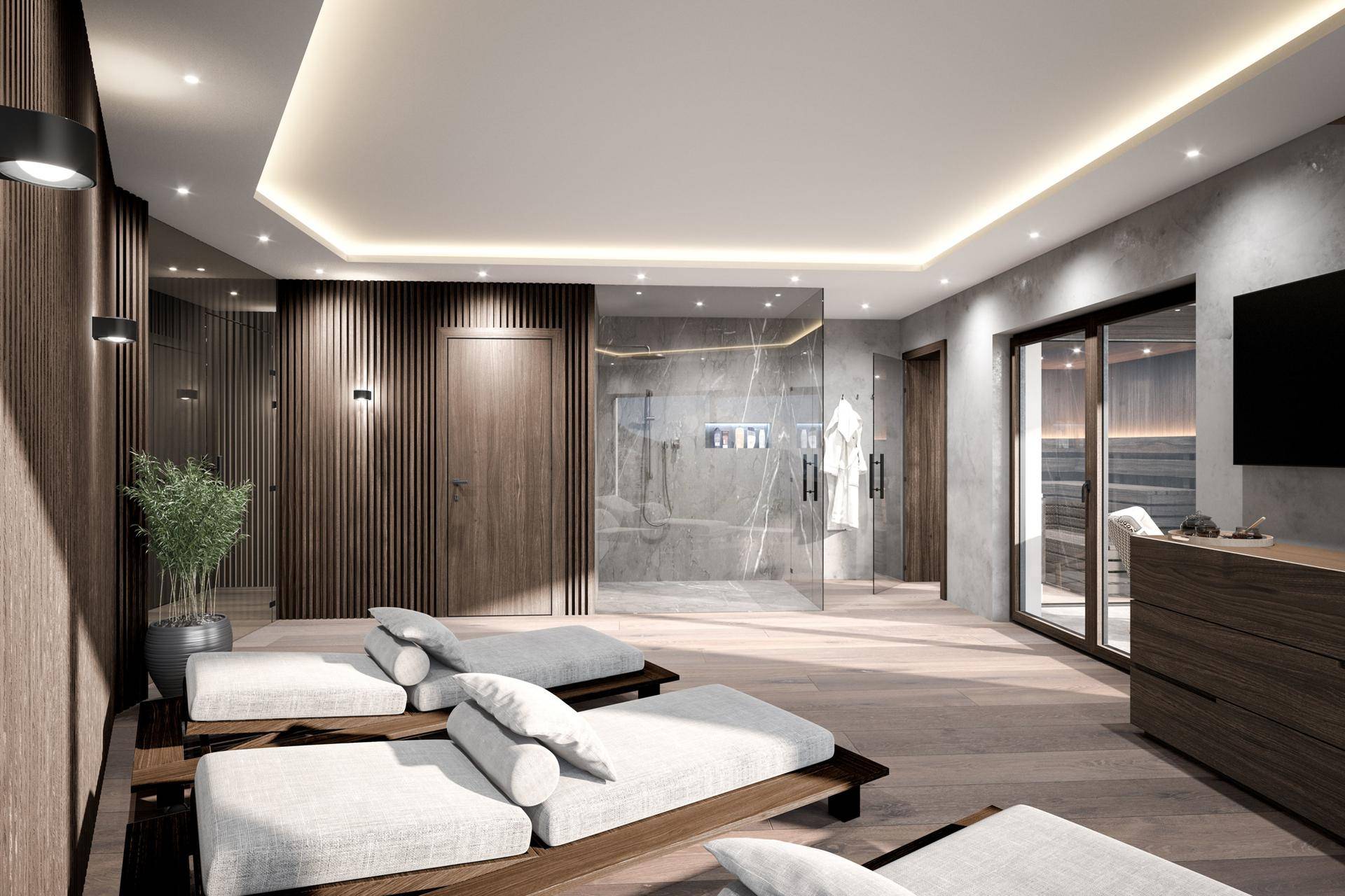 Exklusiver Wellnessbereich mit Ruheliegen, moderner Dusche und angrenzender Sauna.
