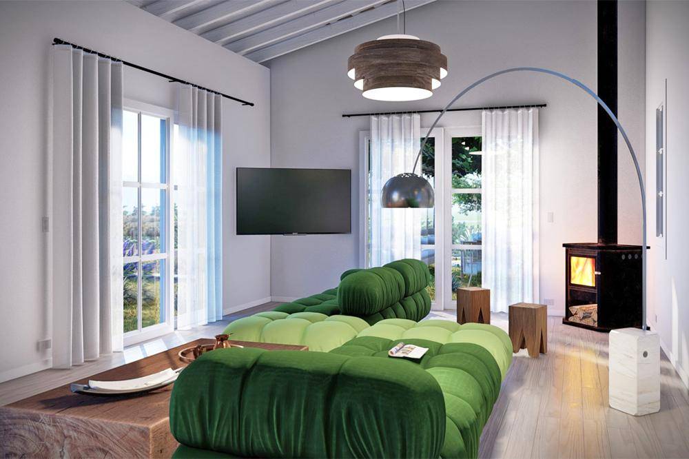 Modernes Wohnzimmer mit grünen Sofas, einem Kamin und großen Fenstern für viel Tageslicht.