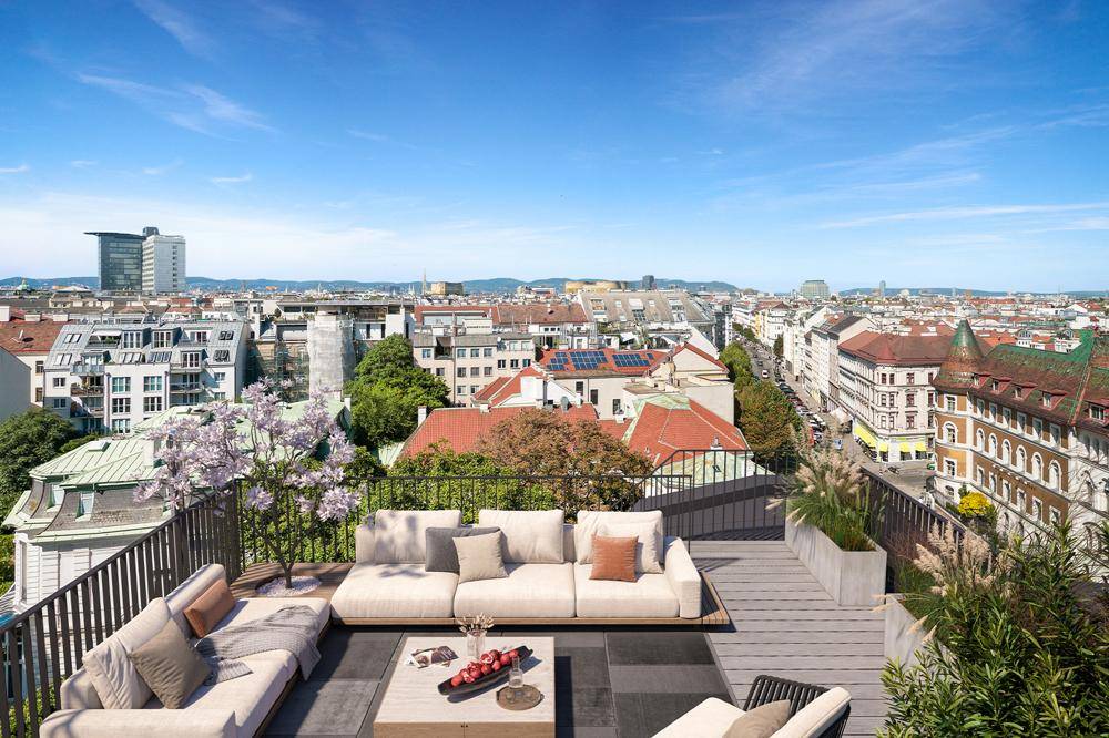 Weitläufige Dachterrasse mit bequemen Lounge-Möbeln und beeindruckendem Panoramablick über die Stadt.
