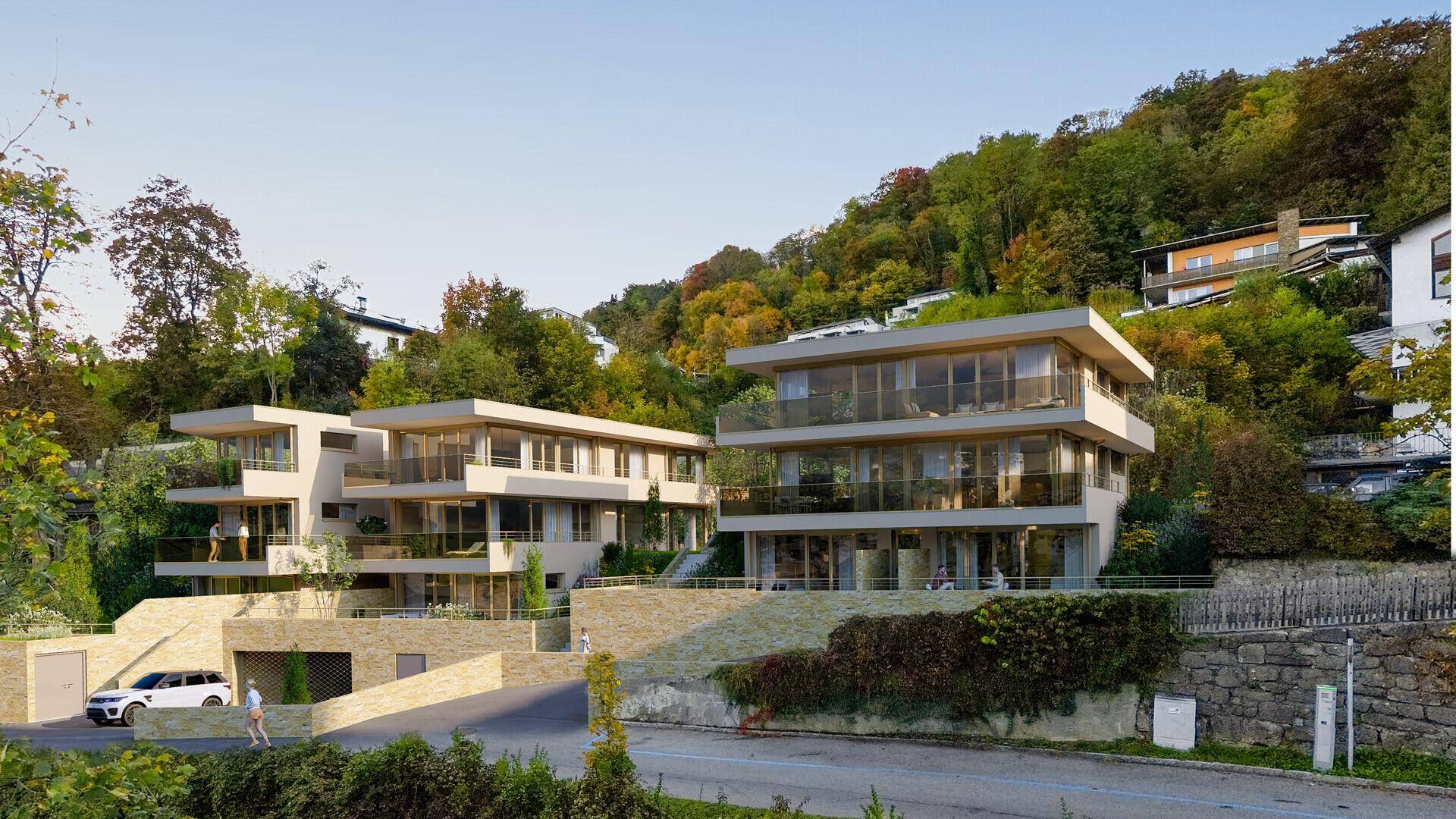 Architektonische Visualisierung eines Wohnkomplexes mit Terrassen und viel Grün in Hanglage.
