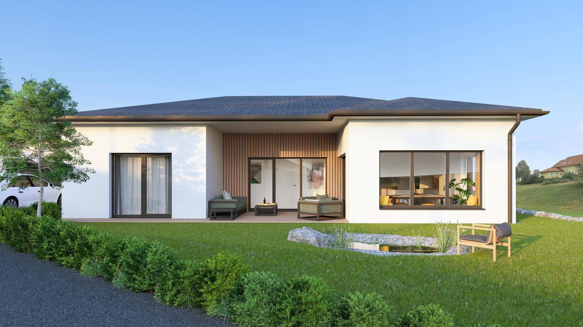 Rückansicht des modernen Hauses mit gepflegtem Garten, kleinem Teich und möblierter Terrasse.