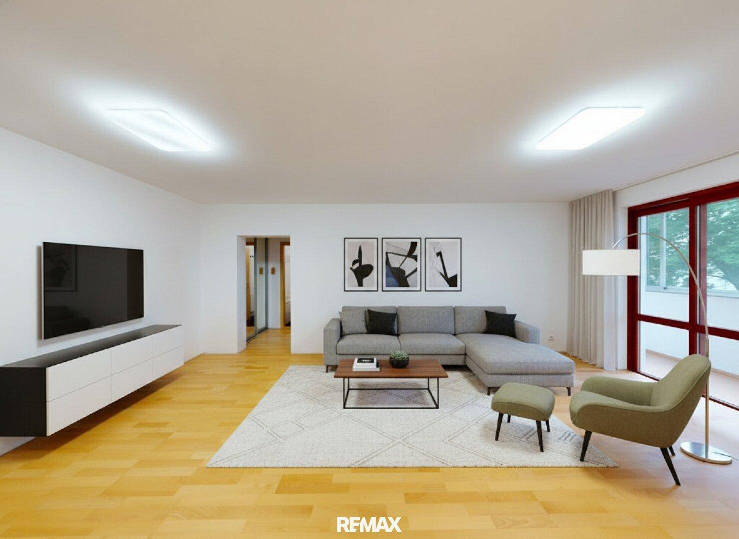 Stilvoll eingerichtetes Wohnzimmer mit modernem Sofa, Fernseher und hellem Parkettboden.