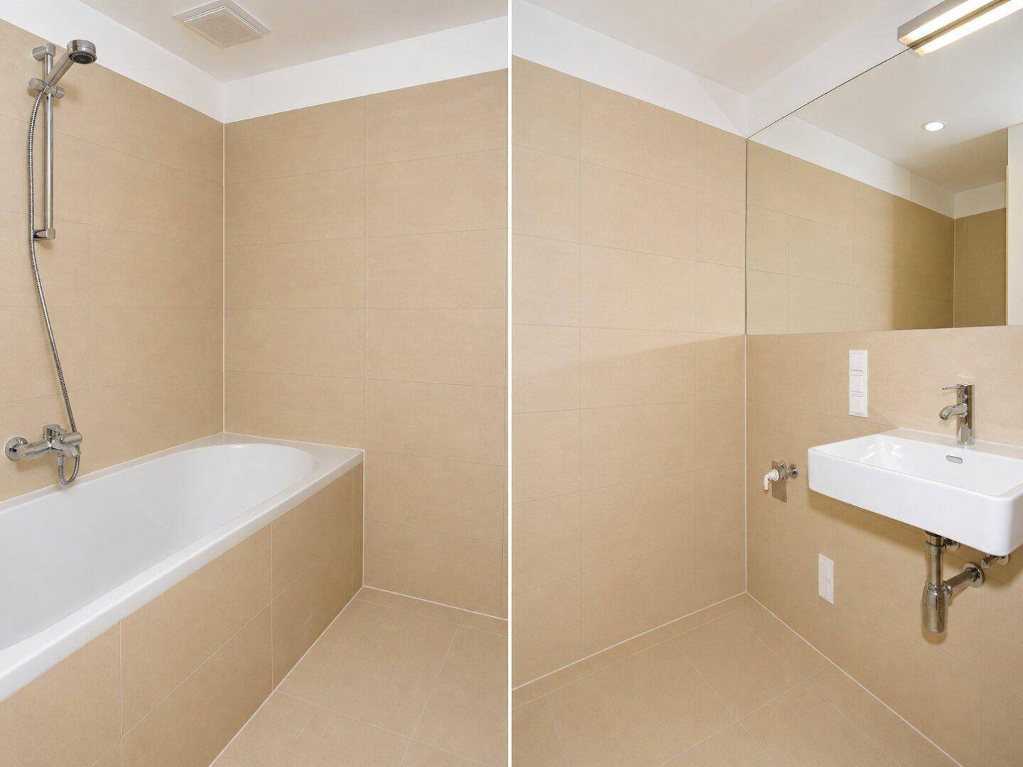 Modernes Badezimmer mit beigefarbenen Fliesen, Badewanne mit Duschfunktion und Waschbecken mit Spiegel.