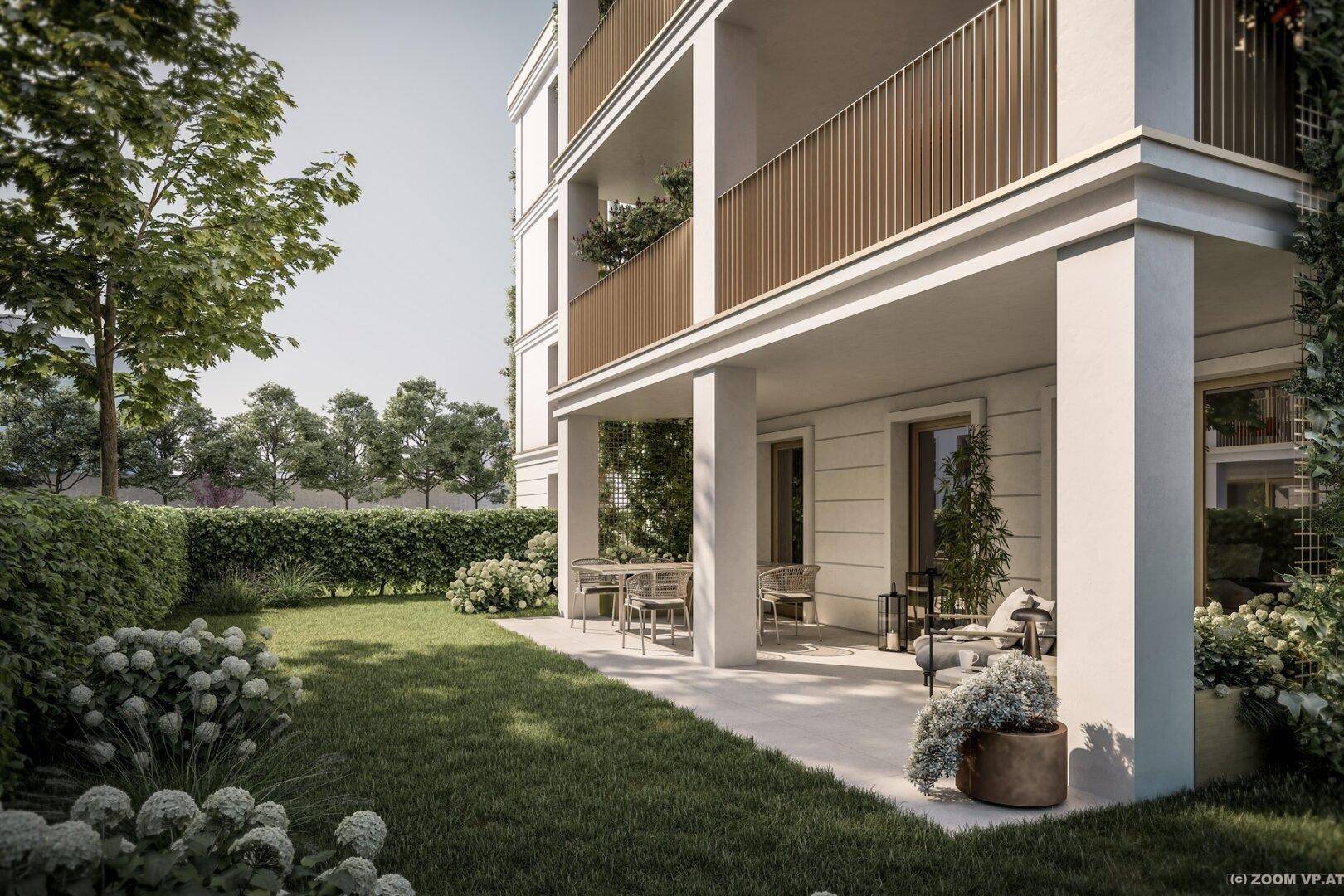 Eine einladende Terrasse mit Gartenmöbeln und direktem Zugang zu einer grünen Rasenfläche.
