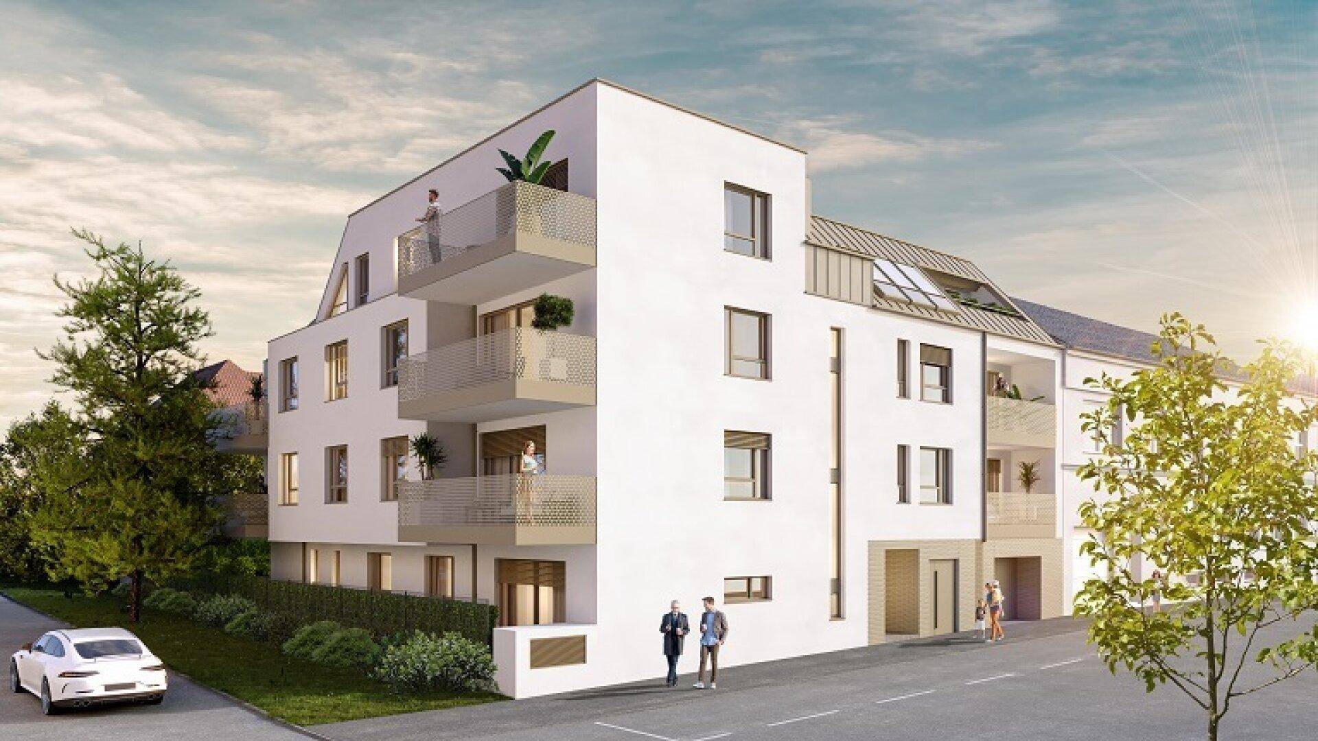 Ansicht des modernen Mehrfamilienhauses von der Straße aus mit klarer Architektur und großen Fenstern.