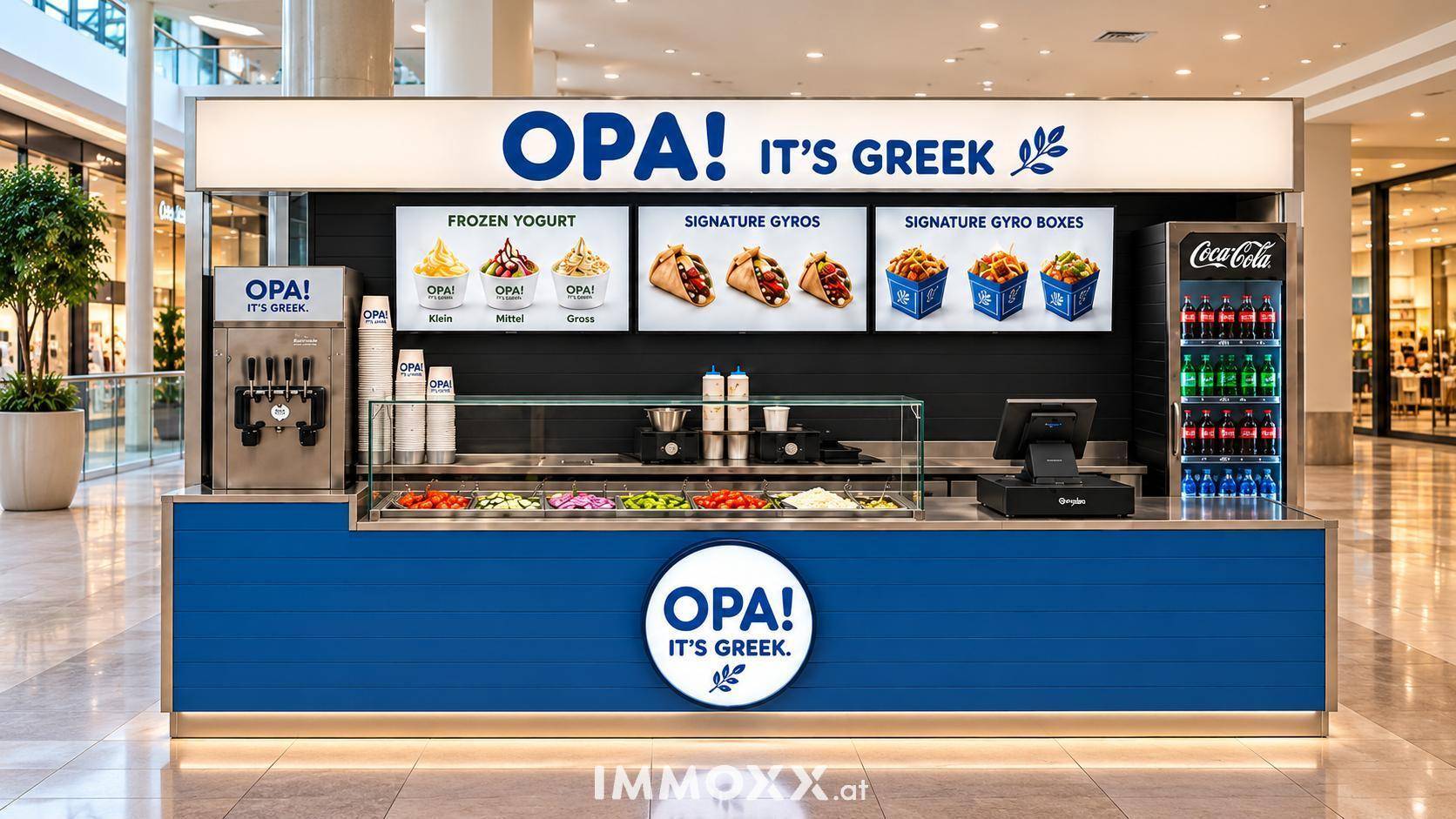 Ein blauer Gyros- und Frozen Yogurt Stand in einem hellen Einkaufszentrum mit modernen Bildschirmen.