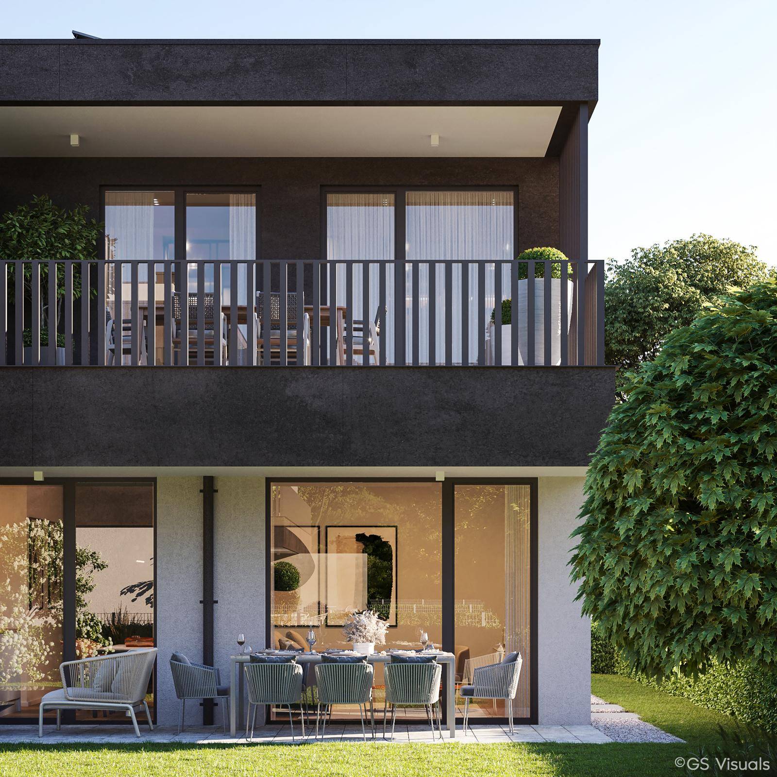 Gemütliche Terrasse im Erdgeschoss mit Essbereich im Freien und Blick auf den Garten.