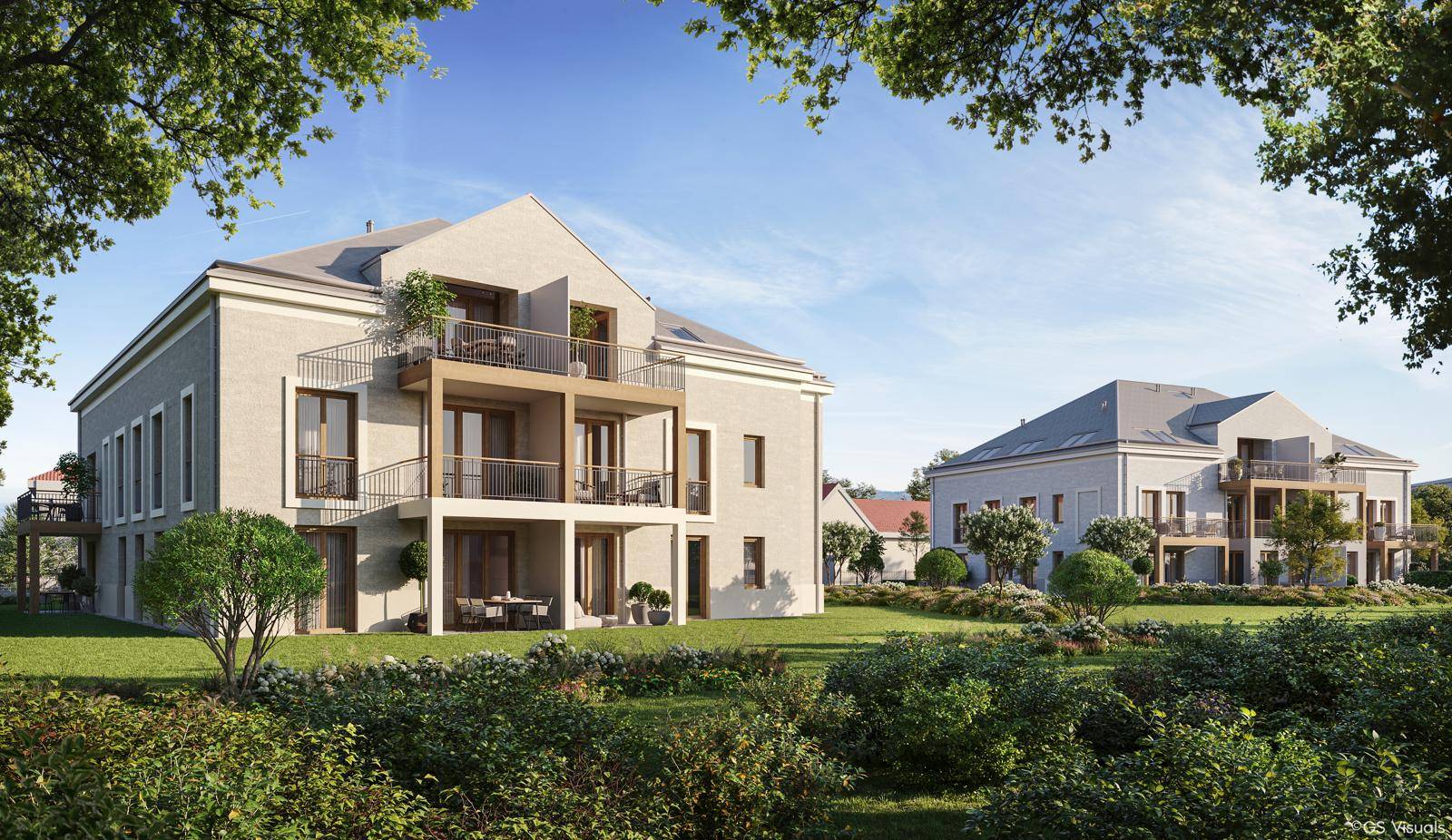 Zwei moderne Gebäude in einer weitläufigen Gartenanlage mit Balkonen und viel Grünfläche.