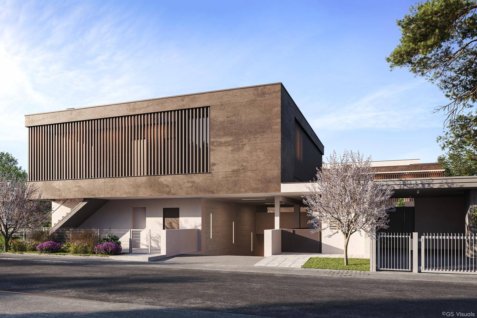 Moderne Architektur mit klaren Linien und einer eleganten Zufahrt zu den Gebäuden.