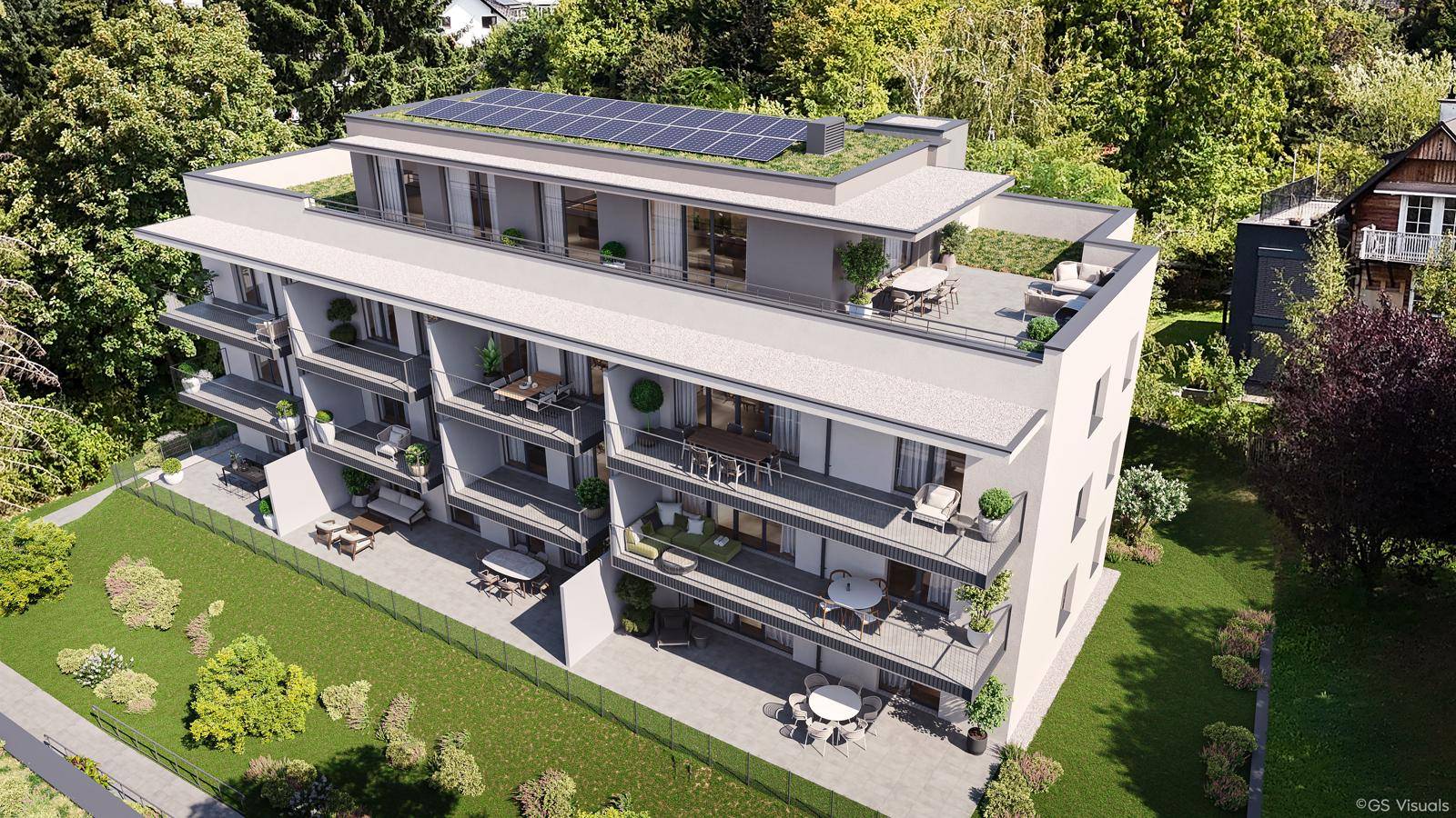 Moderne Wohnanlage mit Balkonen, Flachdach und Photovoltaikanlage auf dem Dach.