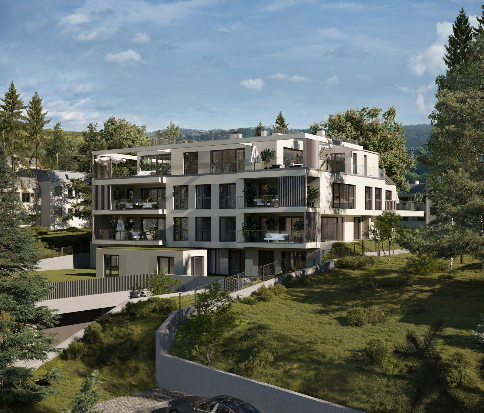 Moderne Wohnanlage in grüner Umgebung mit Terrassen, Balkonen und zeitgenössischer Architektur.