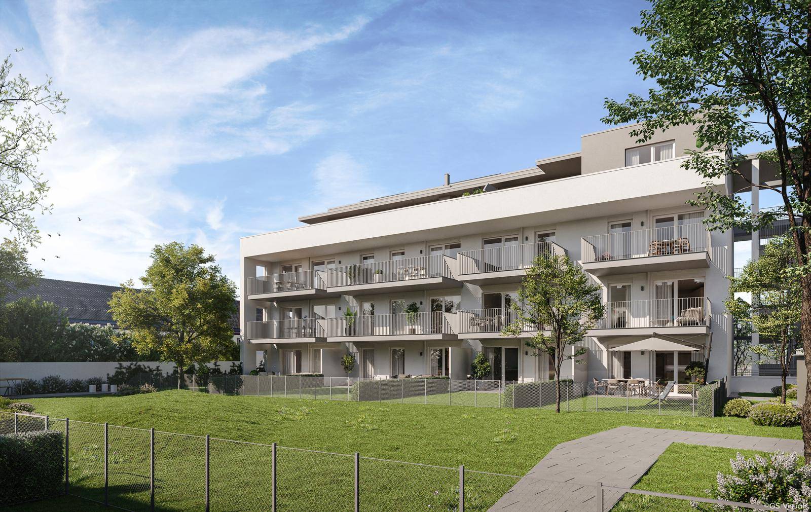 Moderne Wohnanlage mit gepflegtem Rasen, Terrassen und Balkonen in sonniger Lage.