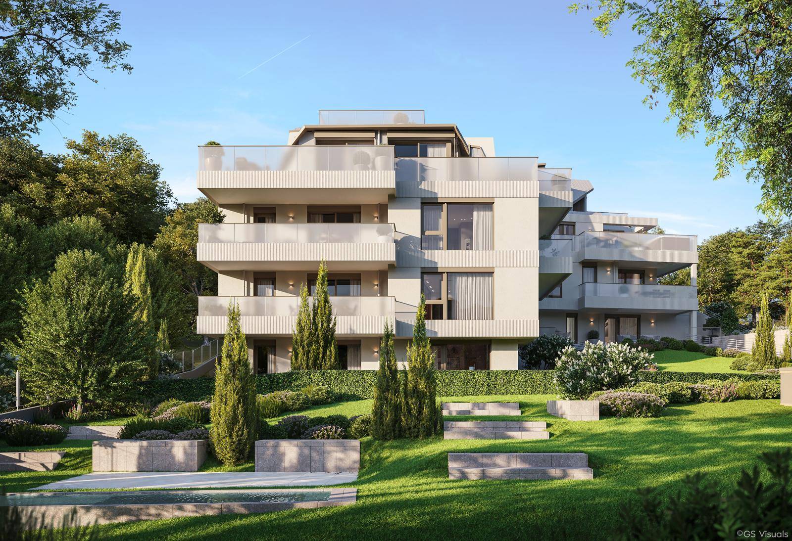 Moderne Architektur eines Mehrfamilienhauses mit großzügigen Balkonen und gepflegter Gartenanlage.