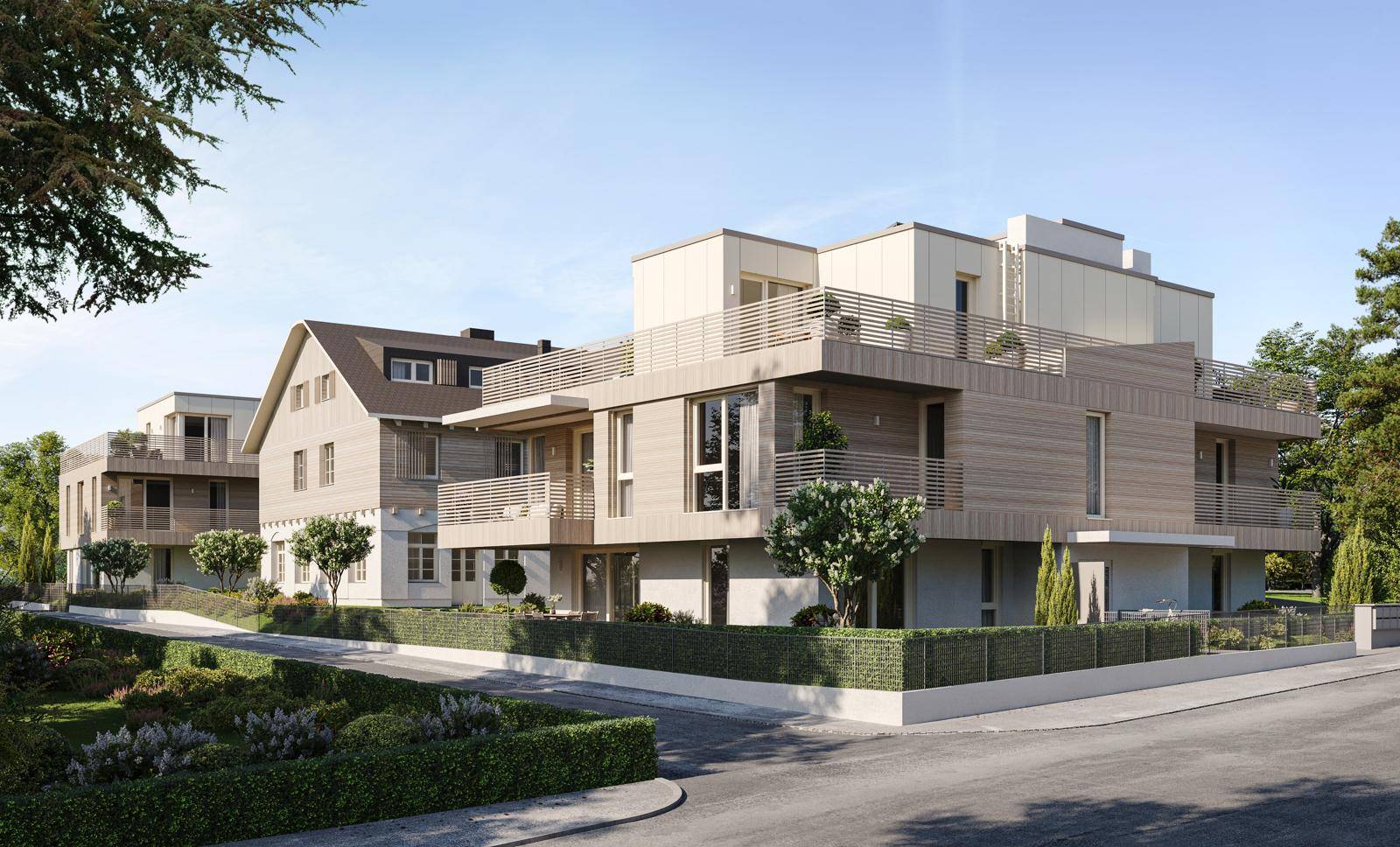 Ansicht der modernen Wohnanlage mit Holzfassade, großen Fenstern und Balkonen.