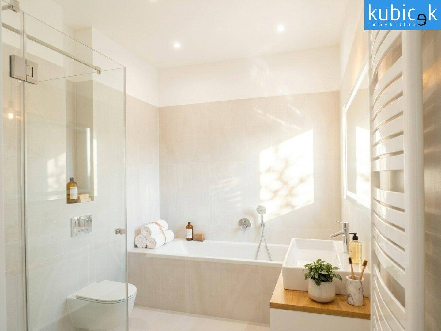 Modernes Badezimmer mit Badewanne, Duschbereich, wandhängendem WC und beheiztem Handtuchhalter.