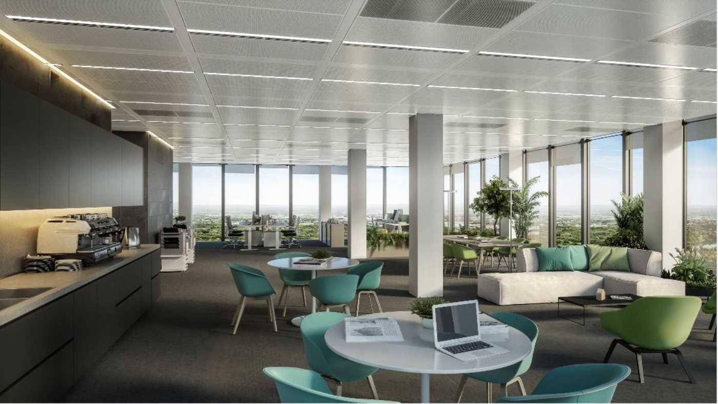 Gemütlicher Loungebereich mit Teeküche, bequemen Sitzgelegenheiten und weitem Ausblick über die Stadt.