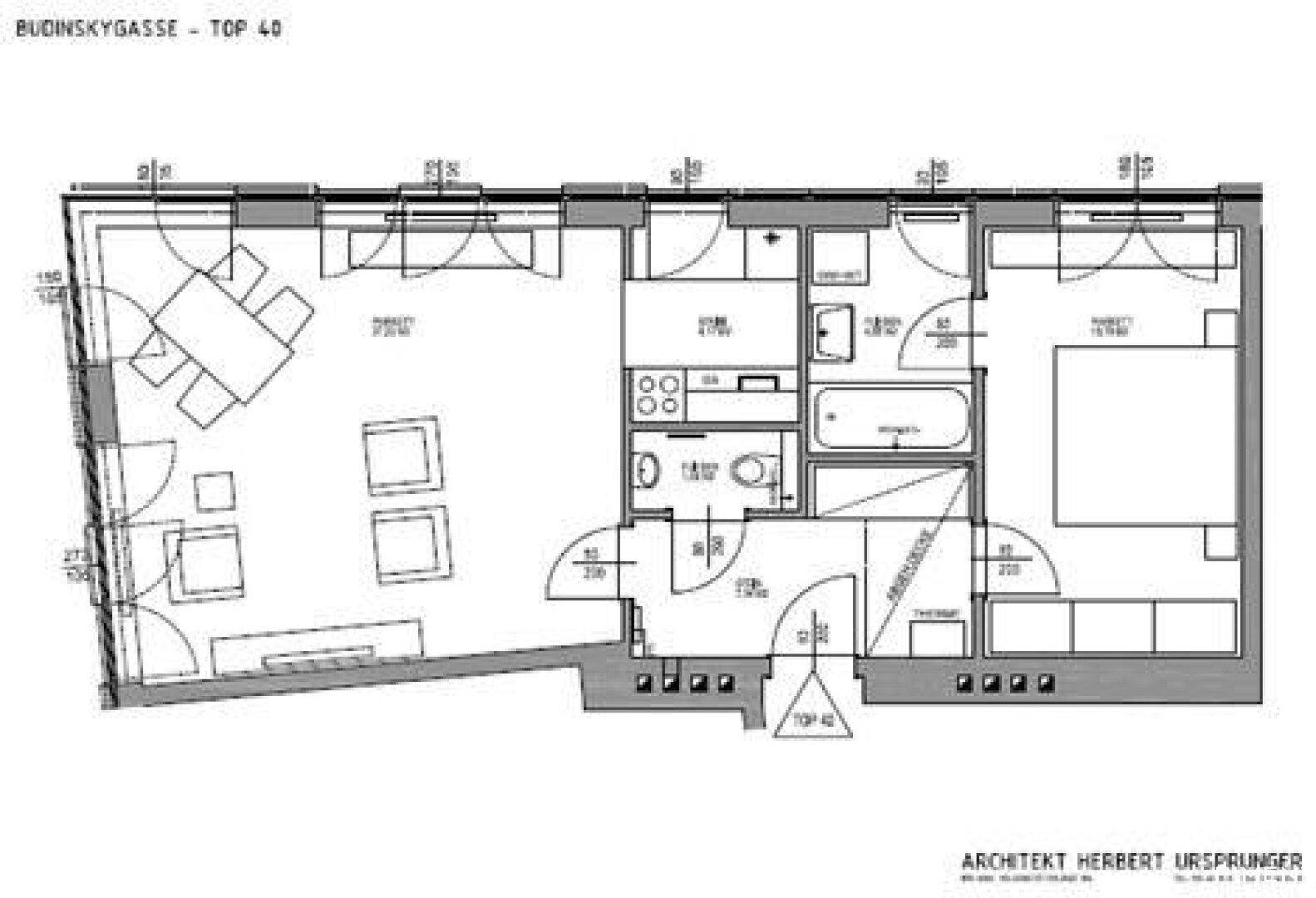 Grundriss der Wohnung mit offenem Wohnbereich, Schlafzimmer und zwei Bädern.