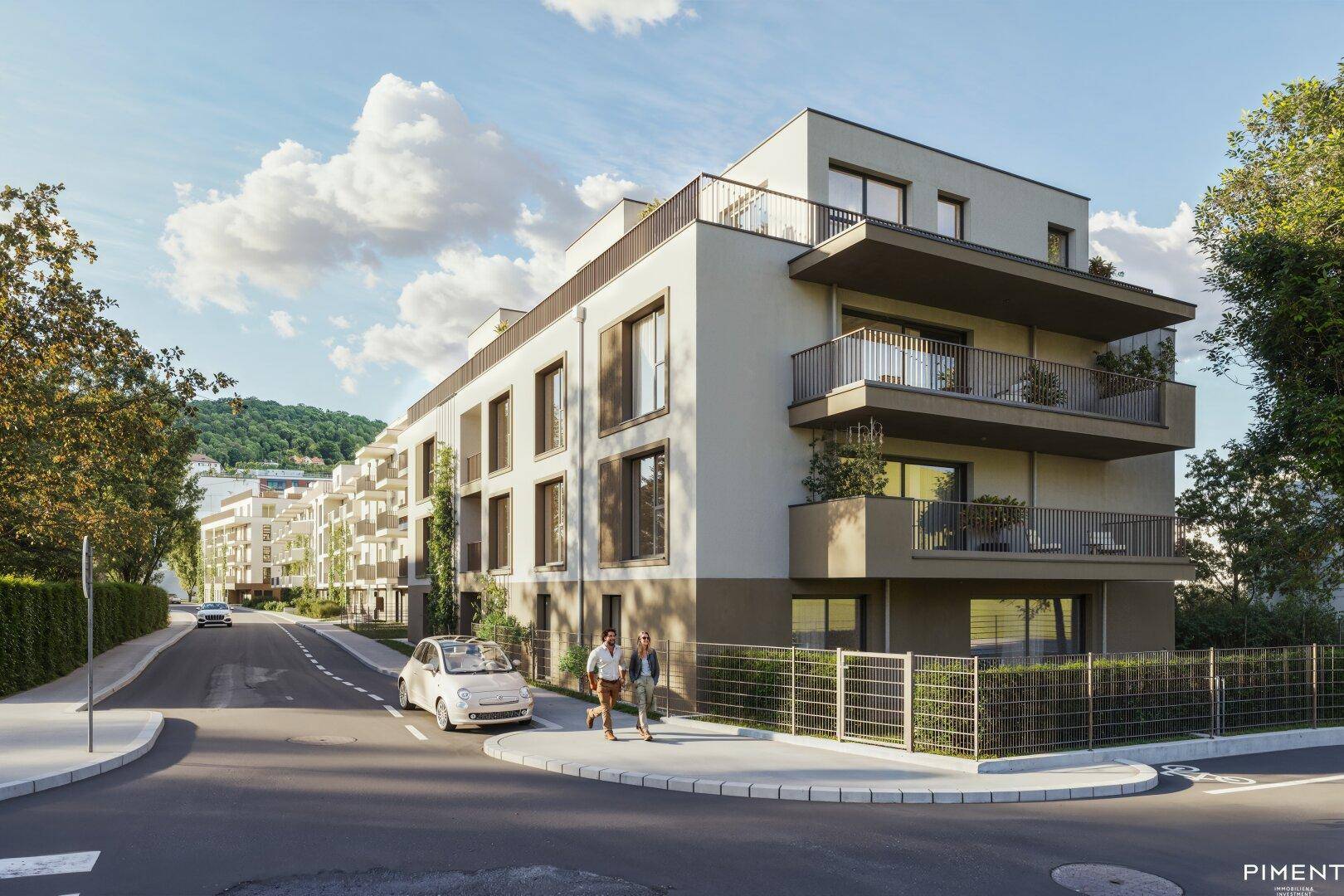 Moderne Wohngebäude mit Balkonen und großen Fenstern entlang einer ruhigen Straße.