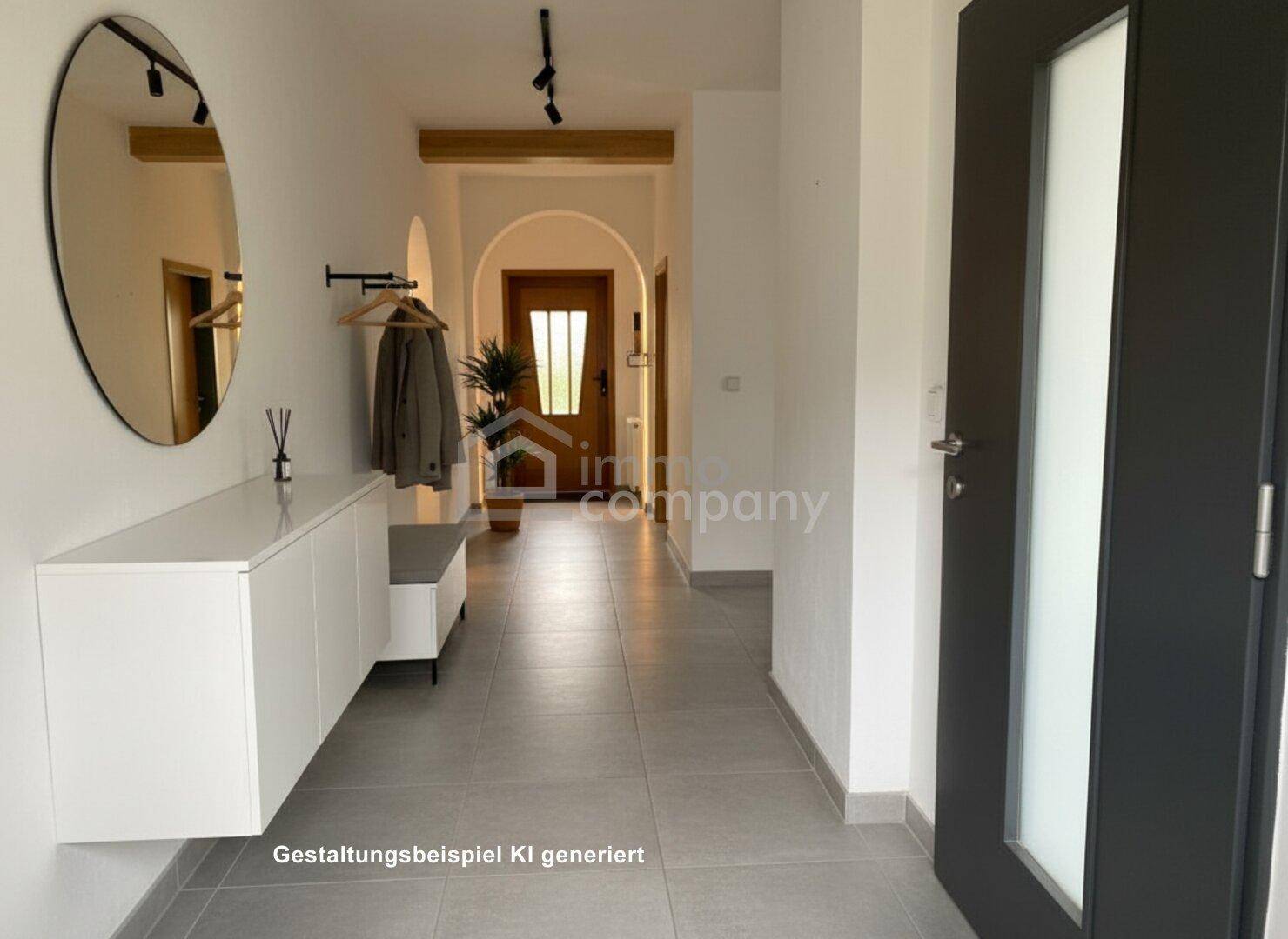 Moderner Flur mit hellen Fliesen, Spiegel und Garderobe, der einladend wirkt.