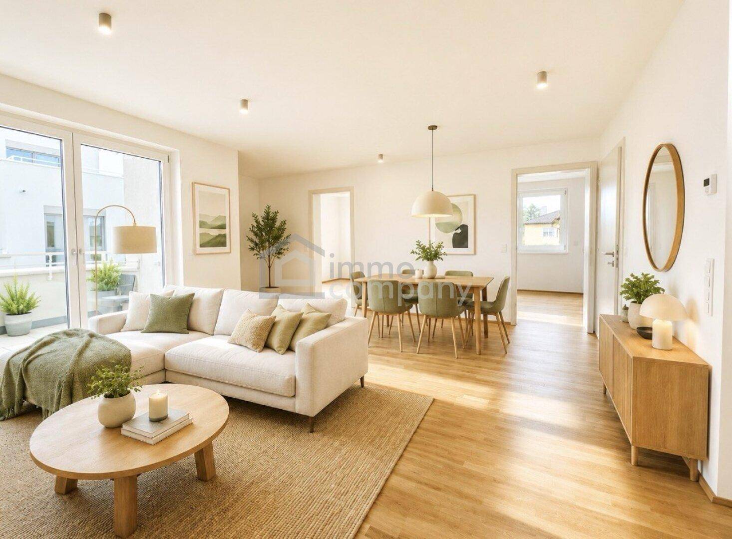 Helles, offen gestaltetes Wohn- und Esszimmer mit modernem Interieur und Zugang zum Balkon.