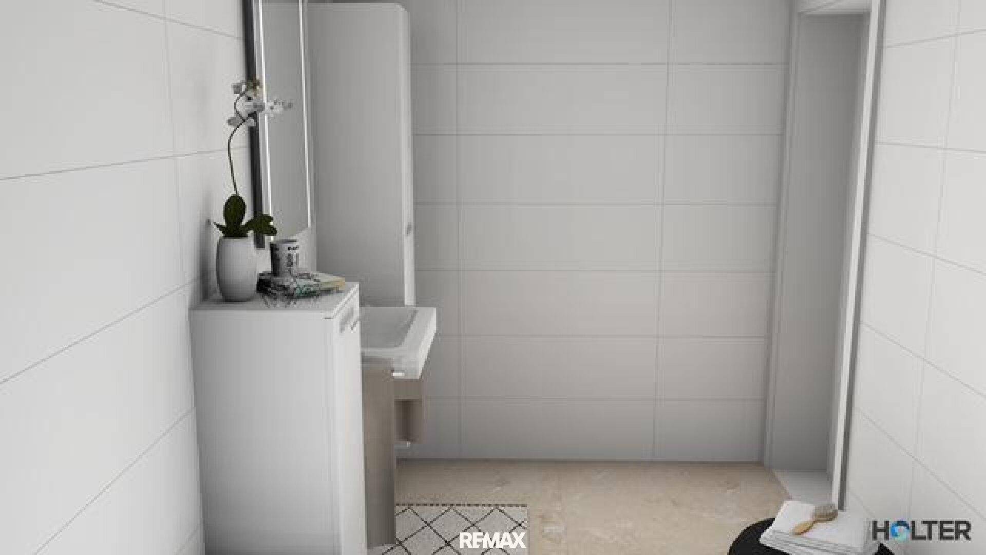 Modernes Badezimmer mit weißen Fliesen, Dusche und minimalistischem Design, gut beleuchtet.