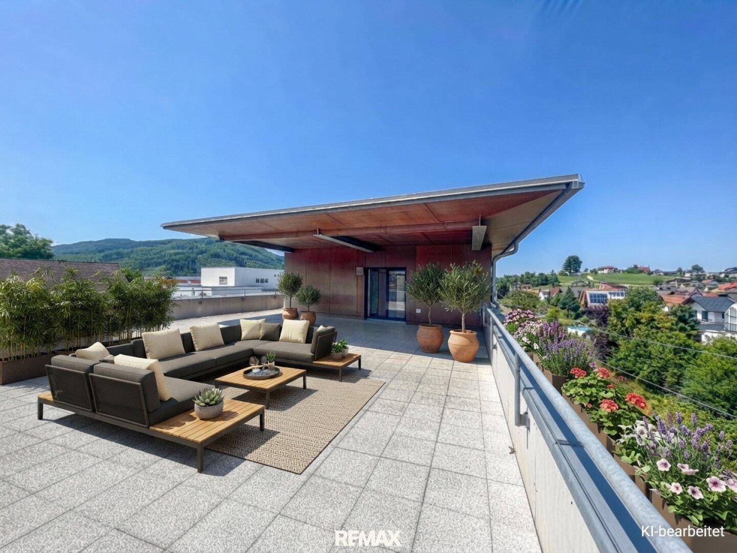Moderne Dachterrasse mit stilvollen Loungemöbeln, üppiger Bepflanzung und weitem Ausblick.